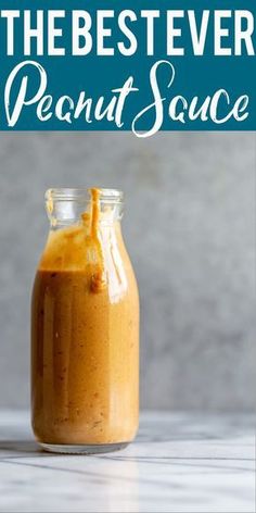 the best ever peanut sauce in a glass jar on a table with text overlay