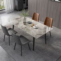 a marble dining table with six chairs and a potted plant on the end shelf