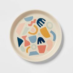 a white plate with colorful shapes on it