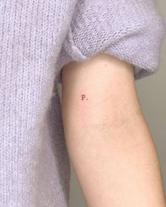 a person's arm with the word instagram on it and an arrow tattoo