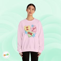 ✨This cute Valentine's Day candy “It Is OK to Stutter” Gildan 18000 unisex sweatshirt is an ideal gift for yourself and friends or relatives who stutter and their stuttering allies. It’s the perfect way to self-advertise that you stutter and to advocate for people who stutter everywhere with a reminder that they're not alone. A portion of the proceeds will go towards National Stuttering Association (NSA) support groups - thanks for supporting the Normalize Stuttering movement! ✨Ideal for any sit Valentine's Day Cotton Sweatshirt Gift, Valentine's Day Gift Cotton Sweatshirt, Trendy Valentine's Day Crew Neck Sweatshirt, Casual Heart Graphic Sweatshirt Gift, Pink Long Sleeve Sweatshirt With Funny Print, Trendy Pink Sweatshirt With Funny Print, Trendy Letter Print Sweatshirt As Gift, Pink Casual Sweatshirt With Heart Graphic, Casual Pink Sweatshirt With Heart Graphic