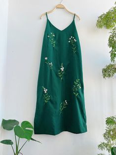 ❤ The hand embroidered linen dress is very soft, skin friendly, breezy and comfortable. ❤ Item description: - A lovely dress with embroidered flowers motifs. - Suitable for hot summer. - Material: linen, button, embroidery threads. - Environmentally friendly. - This dress is very useful, go with any outfit, that can be used to go out, go shopping... It is a perfect gift for yourself or your beloved. ❤ Care instructions: The best way to wash embroidery cloth is to put it in soapy water (with a mi Embroidered Linen Midi Dress For Summer, Summer Embroidered Linen Midi Dress, Embroidered Linen Midi Dress, Cotton Midi Dress With Floral Embroidery For Vacation, Vacation Sundress With Floral Embroidery And Spaghetti Straps, V-neck Linen Dress With Floral Embroidery, Floral Embroidery Linen V-neck Dress, Linen V-neck Dress With Floral Embroidery, Embroidered Cotton Dress With Spaghetti Straps