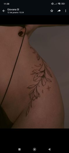 the back of a woman's breast with leaves on it