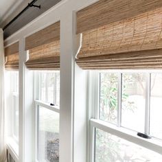 the window sill is covered with bamboo blinds