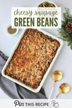 a casserole dish with cheese and green beans in it on a white table