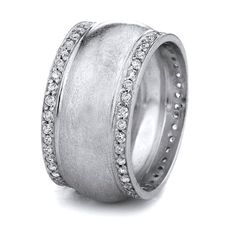 a white gold wedding ring with diamonds on the inside and outside, set in 18k white gold