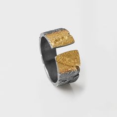 Open Ombre Band by Jenny Reeves. At once refined, edgy, and effortless— this truly is a ring for every occasion. Open-ended design is crafted from textured, oxidized sterling silver with 23.5k gold embellishments. Semi-adjustable ring is available in whole and half sizes 5–8.5. Tapers from 0.33 Keum Boo Jewelry, Etched Jewelry, Keum Boo, Jewelry Bracelets Silver, Contemporary Ring, How To Make Rings, Artful Home, Silver Jewelry Rings, Open Ended