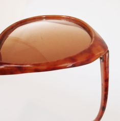 Dating from the late 70s by my estimate, these sunglasses have large gradient brown plastic lenses The frames are marbled opaque plastic in shades of reddish brown. '399 Japan' is barely visible stamped inside one arm. Condition: Just good. I would call the lenses pretty scratched (zoom in to see) and the frames also have some nicks and scratches. Although they do not appear bent at all, when you fold in the arms, they cross rather crookedly (final photo). Still, so cool. Size: The lenses themse Brown Plastic Cat Eye Sunglasses, Vintage Sunglasses With Gradient Lenses, Vintage Plastic Sunglasses With Uva Protection, Vintage Brown Cat Eye Sunglasses With Gradient Lenses, Vintage Brown Cat Eye Sunglasses With Polarized Lenses, Retro Brown Cat Eye Sunglasses With Mirrored Lenses, Vintage Brown Cat Eye Sunglasses With Uv Protection, Retro Brown Cat Eye Sunglasses With Uv Protection, Vintage Brown Cat Eye Sunglasses For Summer