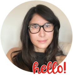 a woman wearing glasses with the words hello written in red and white over her face