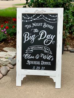 a chalkboard sign that says the night before the big day