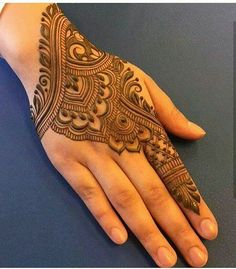 a henna tattoo on someone's hand