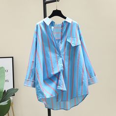 Our stylish Vertical Striped Button-Down Blouse is perfect for any occasion! Get ready to turn heads at work or on the town. The vertical stripes will add an extra dimension of sophistication to your outfit and is available in three different colors. Striped Long Sleeve Blouse For Daywear, Striped Collared Blouse With Placket, Blue Long Sleeve Blouse With Placket, Spring Blue Blouse With Placket, Summer Striped Blouse With Placket, Striped Summer Blouse With Placket, Striped Cotton Blouse With Buttons, Multicolor Long Sleeve Daywear Shirt, Multicolor Long Sleeve Tops For Daywear