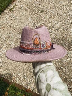 "Handmade Wool Hat  Color: Dusty Purple  Made with recycled materials and handmade elements. Sunstone set in brass, inspired by the red rocks sits at the top of the crown while a string of Moonstone adorns the side.  Check out my stories/millinery highlight on my Instagram for a more in depth chat about this hat! @whileautumnsleeps Hat Circumference: 57-59cm/22.4\"-23.22\" Brim Width: 7cm/2.75\" Height: 12cm/4.72\" Hat care: - each hat has a silk liner that is lightly glued around the inside rim Handmade Bohemian Hat Band For Festivals, Handmade Festival Hats With Round Crown, Red Bohemian Hat As A Gift, Bohemian Red Hat Bands For Festival, Bohemian Handmade Hat Bands For Gift, Unique Adjustable Hat Bands For Festivals, Red Bohemian Hat As Gift, Handmade Adjustable Hat With Round Crown, Artisan Red Hat Bands For Festival