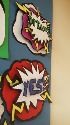 a bulletin board with different types of speech bubbles attached to it's sides and the words yes written on them