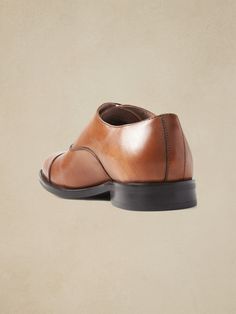 A clean and classic dress shoe with subtle cap-toe design, made in luxurious Italian leather.  Style with no-show socks and a smirk for an irreverent twist that's all confidence.  Flexible, leather or suede upper.  Designed with lightweight, durable Leather Cap, Dress Shoe, Leather Style, No Show Socks, Classic Dress, Toe Designs, Italian Leather, Cognac, Sale Items