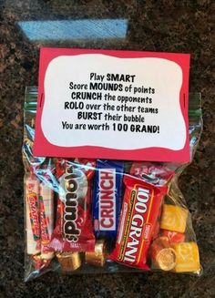 a bag of candy with a sign on it that says, play smart some kind of points crunch the popcorns roll over the other