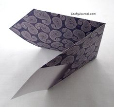 an origami bird with its wings folded open