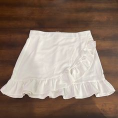 Pants Store Large White Ruffle Skirt Perfect For Summer! Any Questions Please Leave Below! High Waist Solid Skort With Ruffles, High Waist Ruffled Skort In Solid Color, Trendy Short Ruffled Skirt Bottoms, Trendy Ruffled Bottoms For Day Out, Trendy Skirt For Brunch, Casual Bottoms With Ruffle Hem For Day Out, Casual Ruffle Hem Bottoms For Day Out, Casual High Waist Skirt With Ruffle Hem, Trendy Skirted Bottoms For Brunch