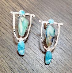 Add a pop of color to your ensemble with these Colorado Earrings. Handcrafted with precious sterling silver and gleaming turquoise colored stones, these unique accessories will bring a touch of fun to any outfit and add an air of sophistication to any occasion. Treat yourself today. Measures 1.3 inches tall x .8 inch wide. Unique, classy, pretty. For dress-up or everyday blue jeans. Metal post backing. Free shipping, 7-18 days delivery. Metal Post, Unique Accessories, Colored Stones, Pretty Earrings, Turquoise Color, Accessories Unique, Stone Color, Blue Jeans, Colorado