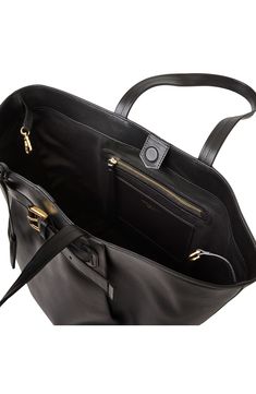 A gleaming buckled strap and soft pleats frame the front of an Italian-crafted bag in a versatile and spacious silhouette. 23" x 14" x 8.5" 11.5" strap drop Two top handles Magnetic top closure Lined Leather/textile Made in Italy Black Designer Bags With Buckle Closure, Designer Bags With Buckle Closure, Designer Black Bags With Buckle Closure, Designer Office Bag With Buckle Closure, Luxury Office Bags With Buckle Closure, Timeless Business Bags With Fold Over Clasp, Classic Business Shoulder Bag With Fold Over Clasp, Luxury Bag With Fold Over Clasp And Double Handle, Timeless Business Satchel With Fold Over Clasp