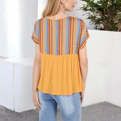 The Anna-Kaci Women's Short Sleeve Boho Peasant Top adds a touch of vibrant style to your wardrobe. Featuring a striped print on the upper half and a flowy, relaxed fit on the lower half, this top is perfect for casual, laid-back days. The tie-front neckline and lightweight fabric enhance comfort and breathability, making it ideal for warm weather. Whether paired with jeans, shorts, or skirts, this bohemian-inspired top offers versatile styling options that complement your everyday look. Spring Beach Patchwork Blouse, Summer Yellow Patchwork Blouse, Multicolor Peasant V-neck Top, Multicolor V-neck Peasant Top For Beach, Yellow Peasant Top For Summer, Yellow Peasant Blouse For Spring, Casual Yellow Patchwork Blouse, Multicolor Peasant Top With Short Sleeves, Multicolor Peasant Short Sleeve Tops