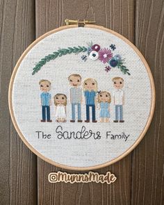 a cross stitch pattern on a wooden background with the words, the sanderss family