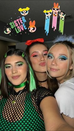 three girls with green hair and makeup posing for the camera