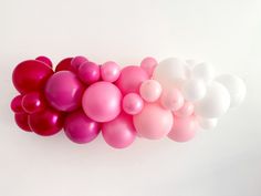 a bunch of balloons that are in the shape of hearts on a white background,