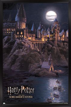 hogwart's castle lit up at night with the moon in the sky