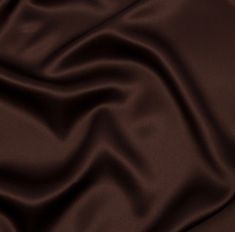 a close up view of a dark brown satin fabric with very high resolution and soft folds