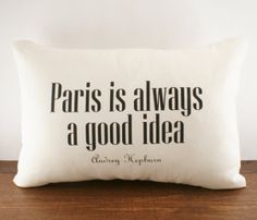 a pillow with the words paris is always a good idea on it, sitting on a table