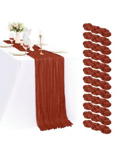 an image of a table setting with red linens and place settings on the table