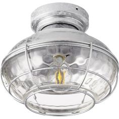 an old fashioned ceiling light with a caged glass shade on the top and bottom