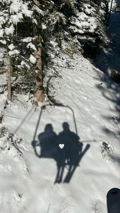 the shadow of a person on skis in the snow