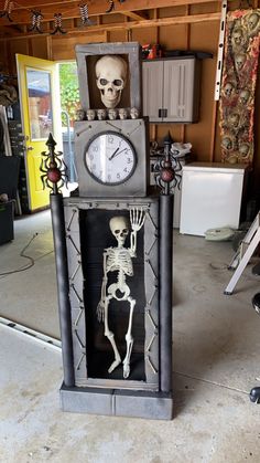 a skeleton clock sitting in the middle of a garage with a skeleton on it's side