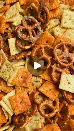 a pile of cheesy crackers and pretzels