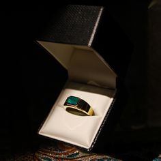 A rare 2 ct Emerald-Cut Mens Pinky Ring. Emerald Sourced from Panjshir, Afghanistan, this design embodies a timeless heirloom. Meticulously set in 18K yellow gold, it stands as a heritage piece. Luxury Yellow Gold Opal Ring, Luxury Yellow Gold Emerald Ring With Polished Finish, Timeless Yellow Gold Signet Ring With Emerald, Timeless Yellow Gold Emerald Signet Ring, Timeless Emerald Signet Ring For Anniversary, Luxury Yellow Gold Opal Ring With Polished Finish, Luxury Gold Emerald Ring For Formal Occasions, Yellow Gold Emerald Signet Ring Gift, Formal Opal Ring