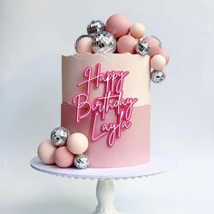 a birthday cake with pink and silver decorations