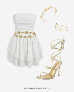 a white dress with gold accessories and high heels