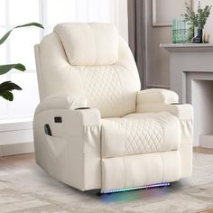 a white recliner chair sitting on top of a rug in front of a fireplace