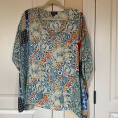 New Never Worn Poncho Style Top. Has Blue Tassel Ties In The Front. 24” Long. Hangs Lower On The Sides. 36” Pit To Pit. Nice Soft Fabric. Blue Tunic Tops For Fall, Blue Casual Tunic With Relaxed Fit, Blue Relaxed Fit Tunic Blouse, Casual Blue Spring Tunic, Blue Tie Neck Tops For Spring, Casual Blue Tunic For Spring, Blue Short Sleeve Casual Tunic, Blue Casual Short Sleeve Tunic, Casual Blue Short Sleeve Tunic