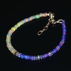 100% Natural & Genuine Ethiopian Opal Stone Gemstone = Natural Opal Color = Multi Color(purple and white) Metal = 925 Sterling Silver Bracelet size = 7 Inche extended upto 9 inches Origin = Ethiopian Bead Size = 3.5 To 5 MM Closer = Hook with a sterling Silver chain Measurements and weight are close to approximations As well as being stunningly beautiful, opal is also the October birthstone and is considered a stone representing hope, innocence and purity. It has strong connotations of happiness White Opal Bracelet, Purple Opal, Opal Color, Opal Bracelet, October Birthstone, Natural Opal, October Birth Stone, White Opal, Opal Jewelry