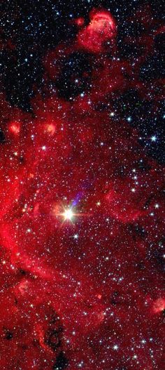 an image of some red stars in the sky