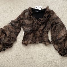 Super Comfortable And Stretchy. Wide Sleeves. 100% Polyester. Black And Brown Animal Print Pattern. Slight Cropped Fit. Size Xs But I’m Usually A Small And It Fits Me Fine Because Of The Stretch Brown Fall Top For Night Out, Brown Tops For Fall Night Out, Brown Long Sleeve Party Tops, Brown Top For Night Out In Fall, Brown Long Sleeve Blouse For Party, Brown Long Sleeve Party Blouse, Fitted Brown Blouse For Night Out, Brown Fall Blouse For Party, Brown Fall Party Blouse