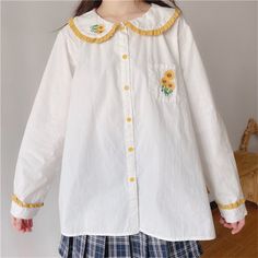 Sunflower Embroidered Mori Kawaii Girl Long Sleeve Lolita Shirt with Peter pan Collar One Size Shoulders: 37cm Bust: 98cm Length: 58cm Sleeve: 56cm Material: Polyester Long Sleeve Kawaii Tops For School, Harajuku Style Cotton Top For School, Kawaii Spring Top With Doll Collar, Spring Kawaii Top With Doll Collar, White Doll Collar Top With Floral Embroidery, White Floral Embroidered Top With Doll Collar, Kawaii Spring Tops For School, Kawaii Tops For School In Spring, Spring Kawaii Tops For School