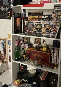 a book shelf filled with lots of toys and collectibles