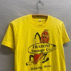 Small / 1980s Fraboni Sausage Co. Hibbing, MN Yellow T Shirt USA Made Pit to Pit: 17in // Top Collar to Bottom: 24in Tagged M, fits modern S. Small pinhole in left underarm (check last photo). Yellow T Shirt, Caricatures, Fancy Dresses, Halloween Shopping, Shop House, Gender Neutral, Bathing Beauties, Cute Outfits, Adult Outfits