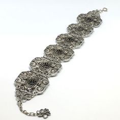 This bracelet is part of our Premium Master Collection. The bracelet was made by one of our family's master jewelers.  The entire bracelet is hand made with filigree techniques used by old filigree masters. The material used is sterling silver (925) and fine sliver (999). Creating this particular bracelet required patience, extensive work, creativity and it is one of the unique pieces amongst all of our collections. This bracelet reminds us of endurance, patience and delicateness. Bracelet Lengt Silver Chain Bracelet With Intricate Design, Sterling Silver Bangle With Intricate Design, Adjustable Oxidized Silver Chain Bracelet, Elegant Sterling Silver Chain Bracelet With Intricate Design, Adjustable Silver Chain Bracelet With Oxidized Finish, Traditional Oxidized Silver Chain Bracelet, Adjustable Oxidized Chain Bracelet, Traditional Silver Oxidized Chain Bracelet, Traditional Silver Chain Bracelet With Oxidized Finish