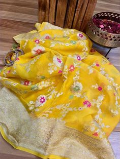 Update! - Zynah covered by LBB - https://lbb.in/bangalore/zynah-designs-handloom-sarees/ Banarasi pure georgette woven saree, decorated with intricate design. Their special characteristics are Mughal inspired designs such as intricate interwining floral and foliate motifs. Other features are gold/Silver work, compact weaving, figures with small details, metallic visual effects, pallus, jal (a net like pattern). Depending on the intricacy of its designs and patterns, a saree can take from 15 days Georgette Kurta With Unstitched Blouse In Saree Shape, Semi-stitched Banarasi Silk Blouse With Chikankari Embroidery, Yellow Sharara With Chikankari Embroidery In Art Silk, Yellow Art Silk Sharara With Chikankari Embroidery, Yellow Chikankari Embroidery Sharara In Art Silk, Bollywood Banarasi Silk Saree With Chikankari Embroidery, Eid Banarasi Silk Blouse With Chikankari Embroidery, Banarasi Silk Blouse Piece With Chikankari Embroidery For Eid, Banarasi Silk Blouse Piece With Chikankari For Eid