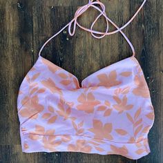 Backless Halter Top. Silky Material. Vibrant Orange And Pink Floral Pattern. Size 4/Small. Tts. Never Worn Pink Crop Top With Built-in Bra, Pink Tops With Built-in Bra For Day Out, Pink Summer Halter Top With Built-in Bra, Pink Cropped Crop Top With Built-in Bra, Feminine Fitted Crop Top For Beach, Fitted Feminine Beach Crop Top, Fitted Bra-friendly Pink Crop Top, Fitted Feminine Crop Top For Beach, Pink Bra Friendly Top For Spring